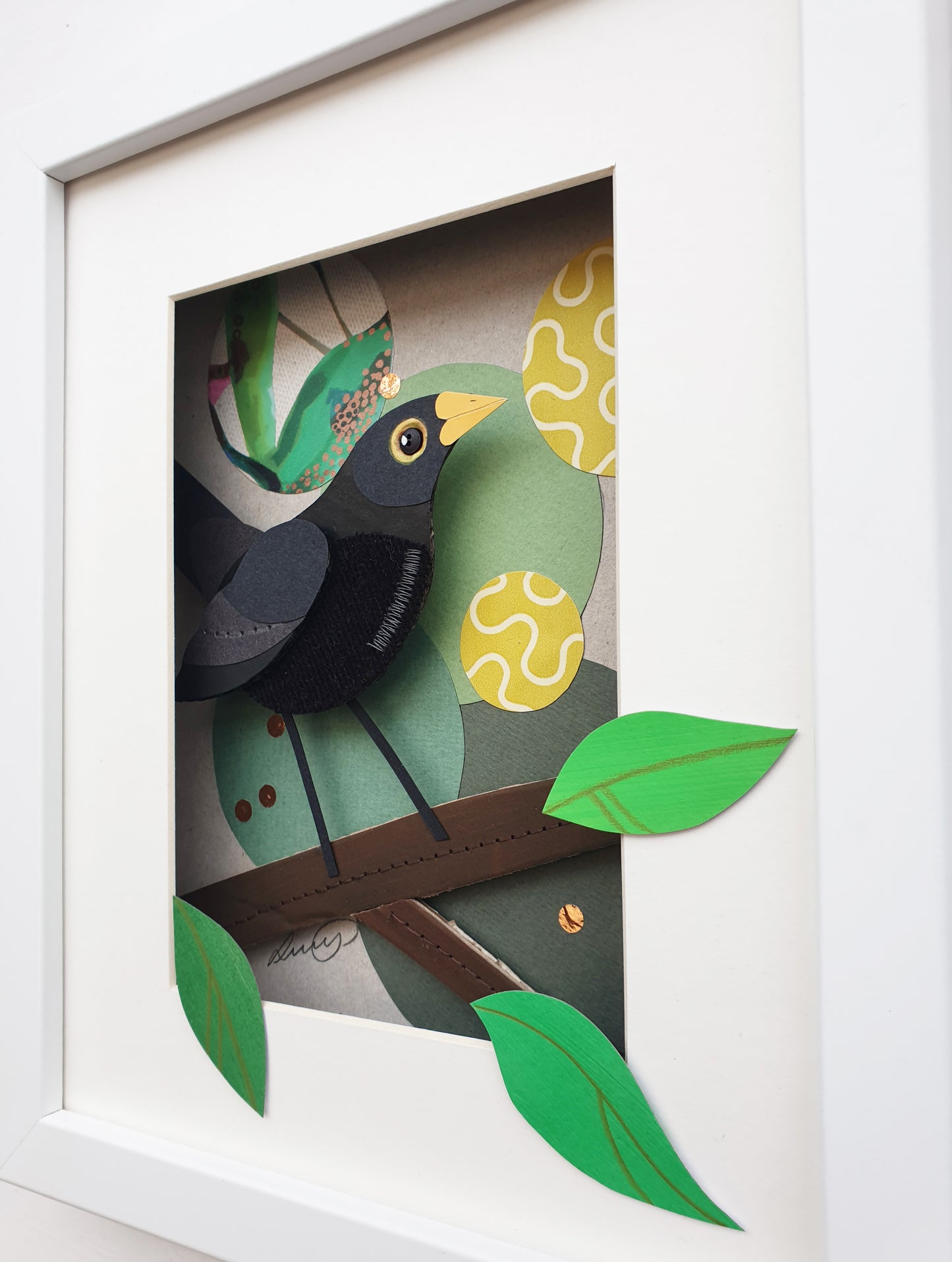 Blackbird artwork seen at an angle.