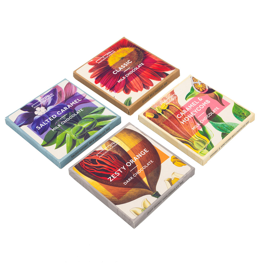 Four colourful square packages of chocolate, presented in a grid format against a white backdrop.