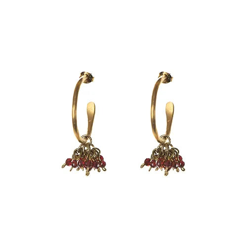 A pair of gold-toned hoop earrings with multiple small, dark red garnet gemstones dangling from each hoop.