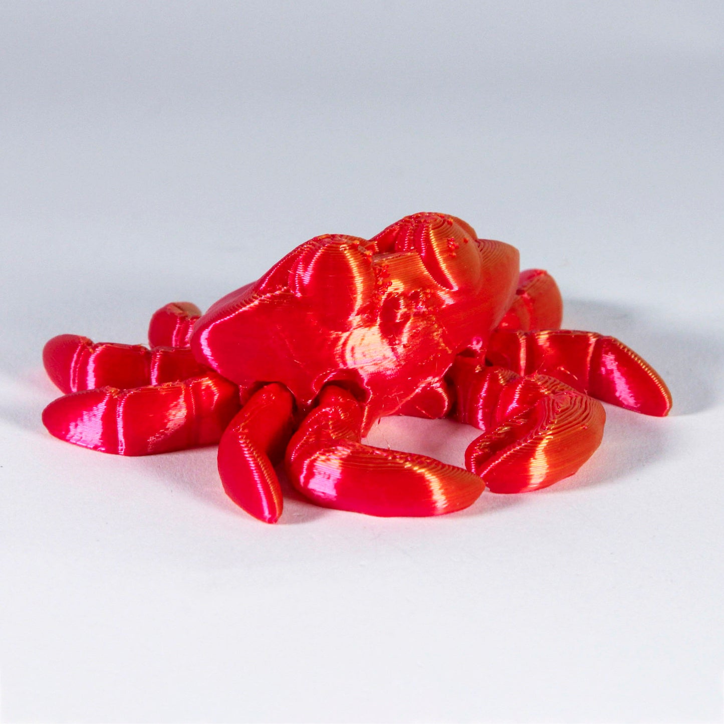 Segmented red crab fidget toys.