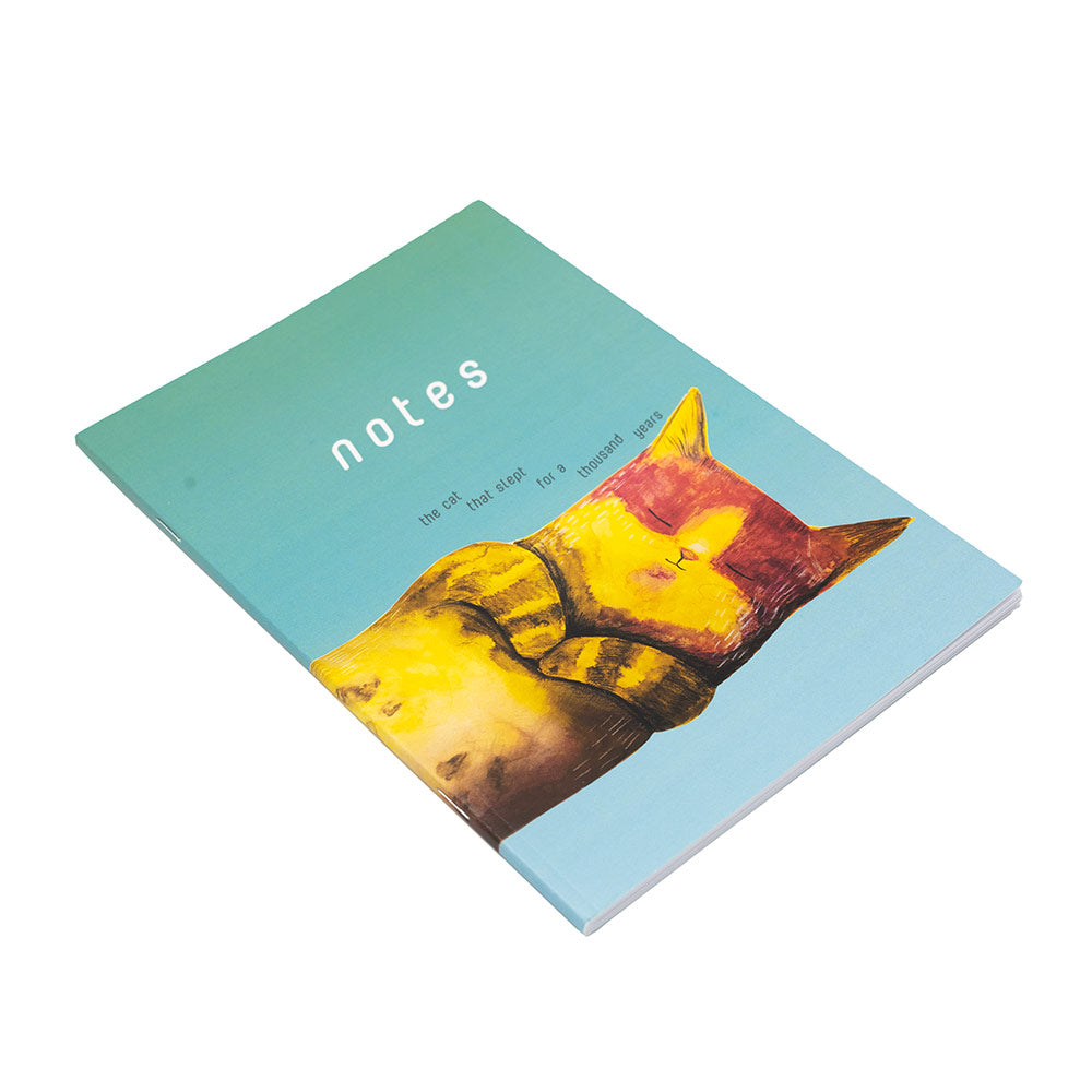 Notebook with a cat illustration on a light blue cover