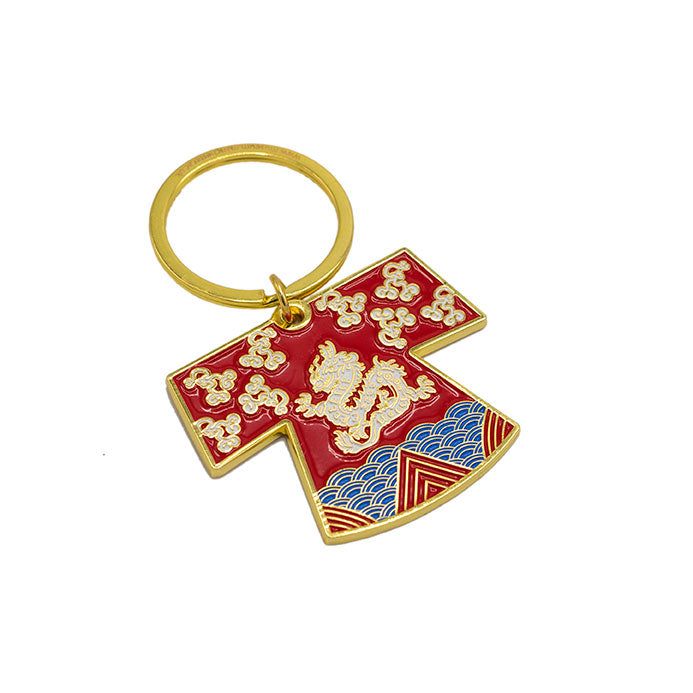 Keyring in the shape of a red robe with a dragon on it.