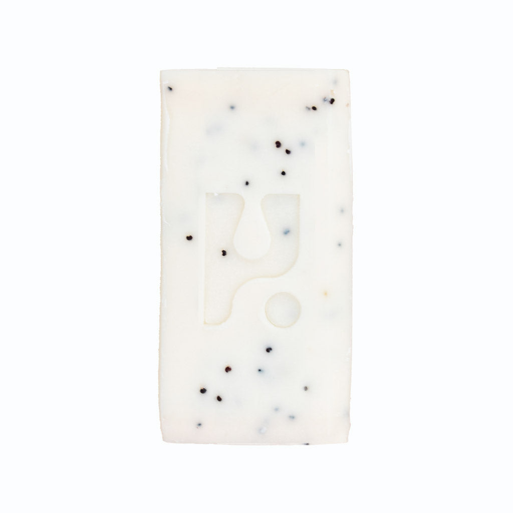 White soap bar with black speckles