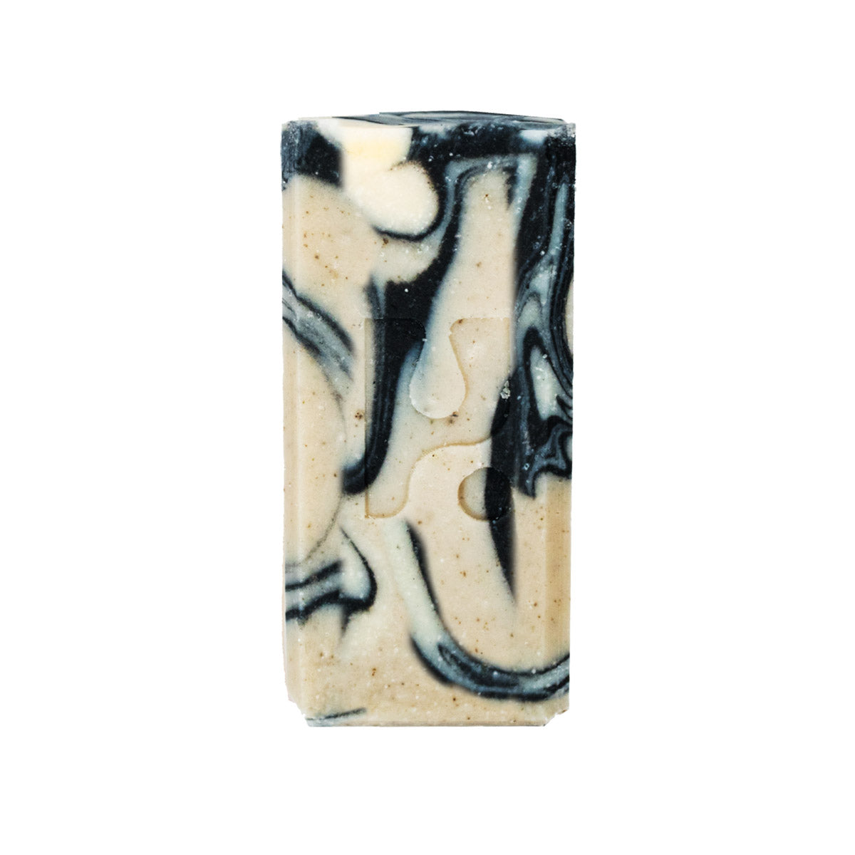 This is a close-up shot of a rectangle bar of soap with a swirled pattern of black and light beige colours, isolated on a white background.