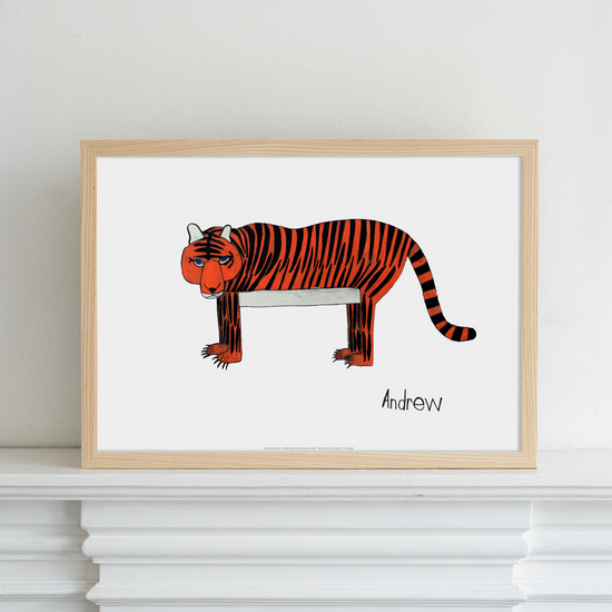 Framed print of a tiger on a white mantlepiece