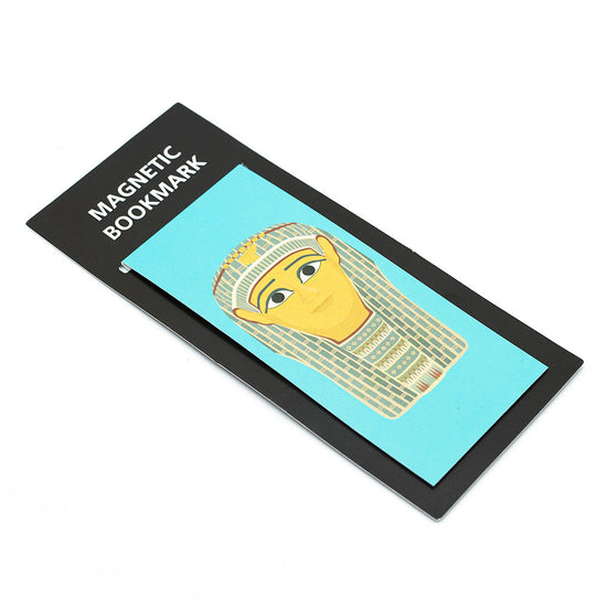 Slightly angled view of turquoise burial mask illustration bookmark agaisnt a white backdrop.