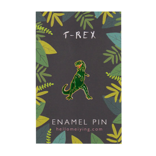 Tyrannosaurus pin on the dark green backing card.