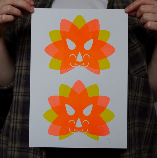 Person holding up dinosaur print