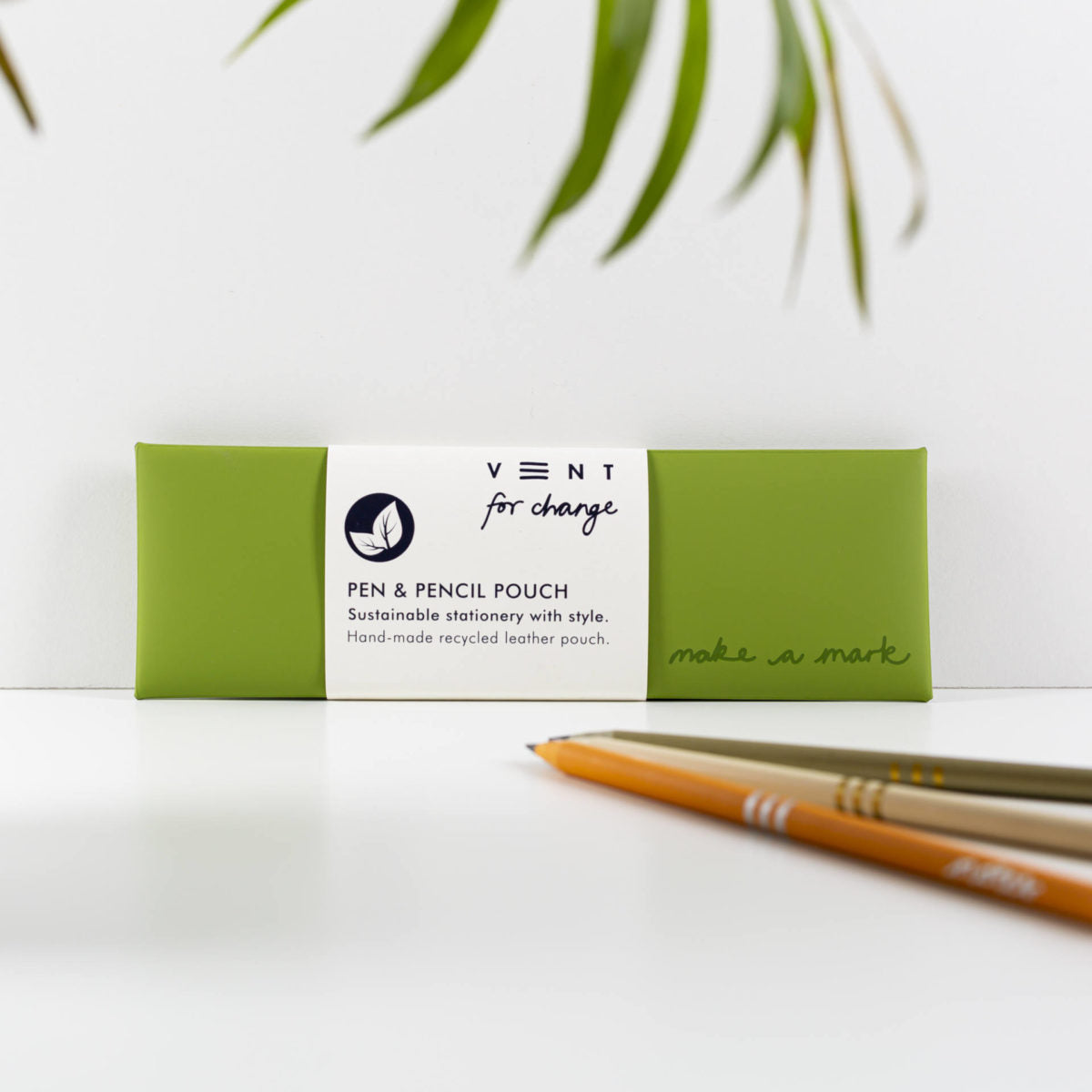 Green pen and pencil pouch with a white label on a white background