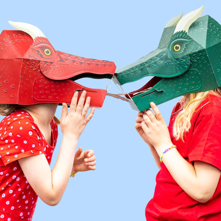 Lifestyle photo of two kids wearing a red and green dragon mask.