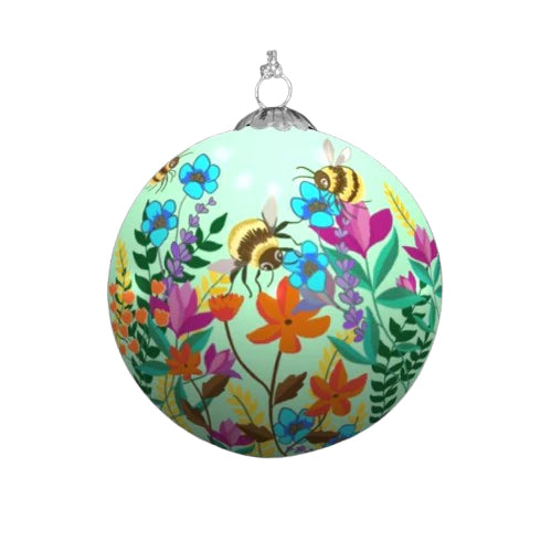 A colourful Christmas ornament depicting a vibrant garden scene with blooming flowers and buzzing bumblebees. The ornament has a light green background.