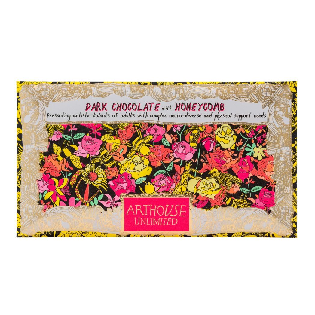 Chocolate bar inside the packaging on white background. The packaging has gold foil around the edges and a hot pink rectangle at the bottom with Arthouse Unlimited in gold text inside. The illustration is a brightly coloured, abstract scene with flowers and bees.