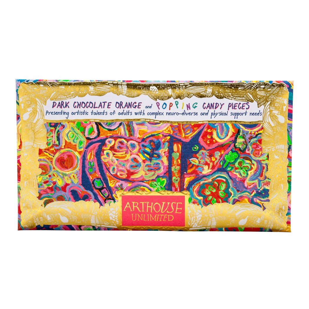 Chocolate bar inside the packaging on white background. The packaging has gold foil around the edges and a hot pink rectangle at the bottom with Arthouse Unlimited in gold text inside. The illustration is a brightly coloured, abstract scene.