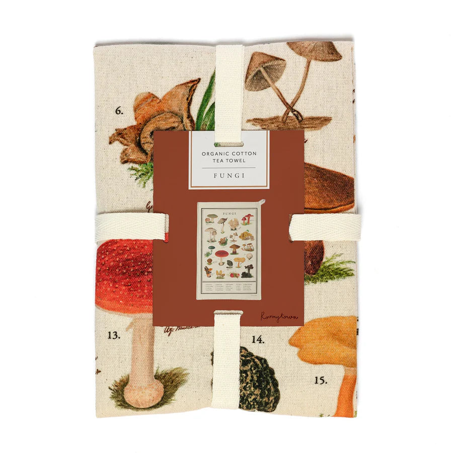 Packaged tea towel with mushroom design on a white background