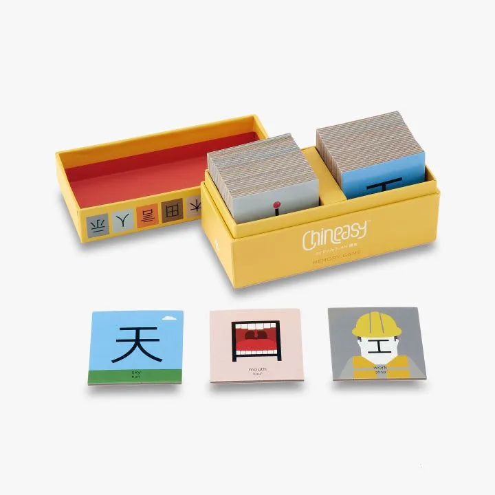 Different components of a memory game including cards and the packaging.