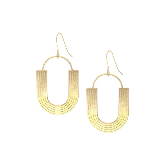 Gold U shaped earrings against a white background.