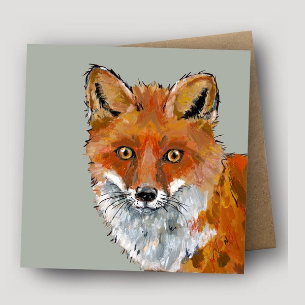 Square greetings card with a red fox portrait and kraft envelope behind.