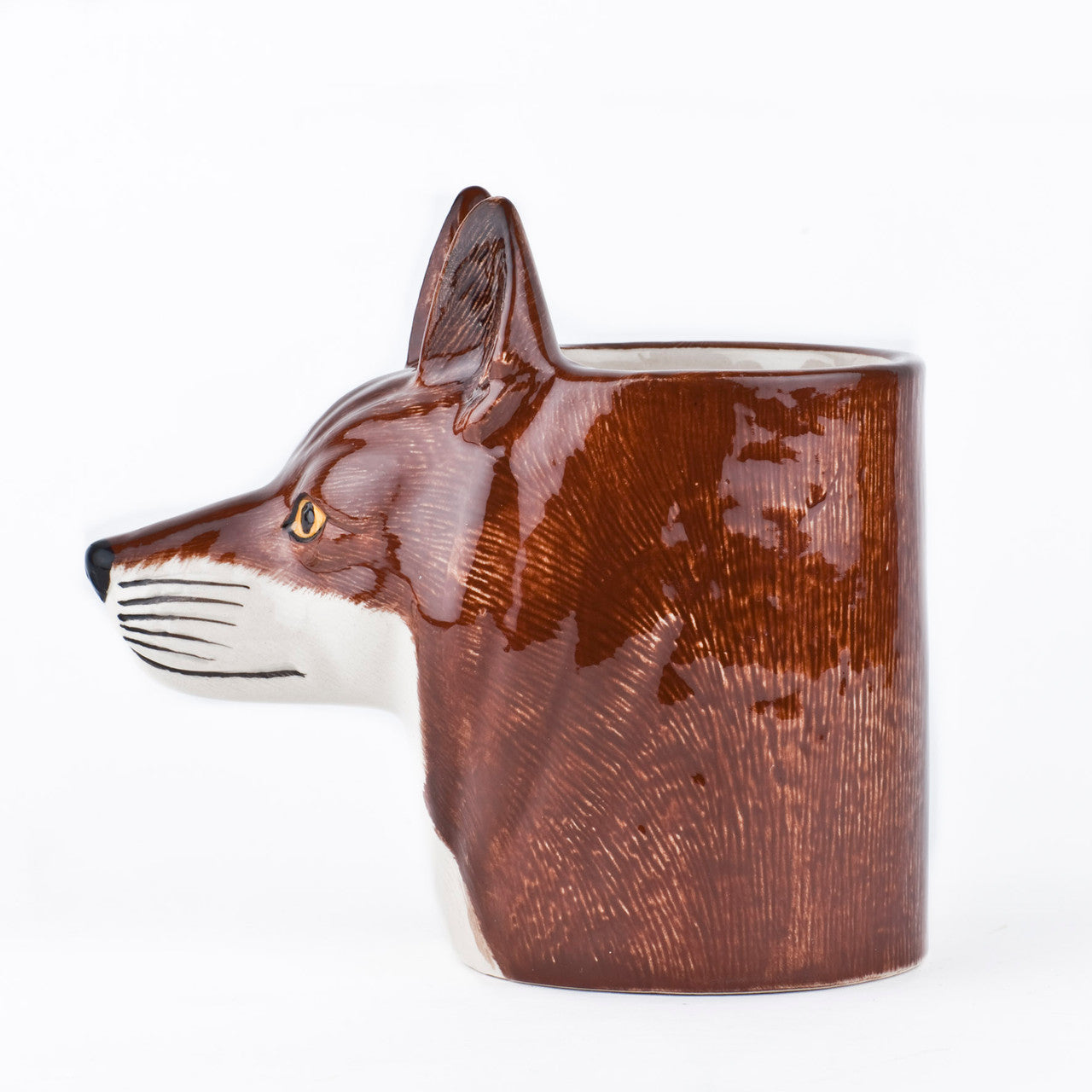 Fox pencil pot seen from the side with the face of the fox looking to the left.