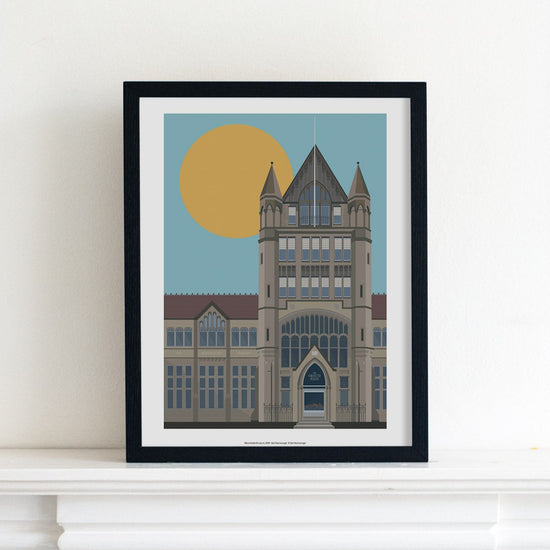 Digital illustration print of Manchester Museum, placed in a black frame and sat on a mantelpiece.