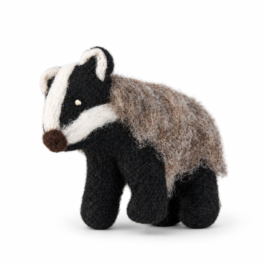 Wool felt badger ornament featuring distinctive facial markings and a hanging loop.