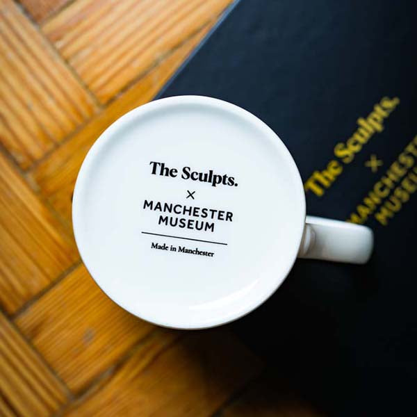 The base of a mug with the Sculpts and Manchester Museum logo w