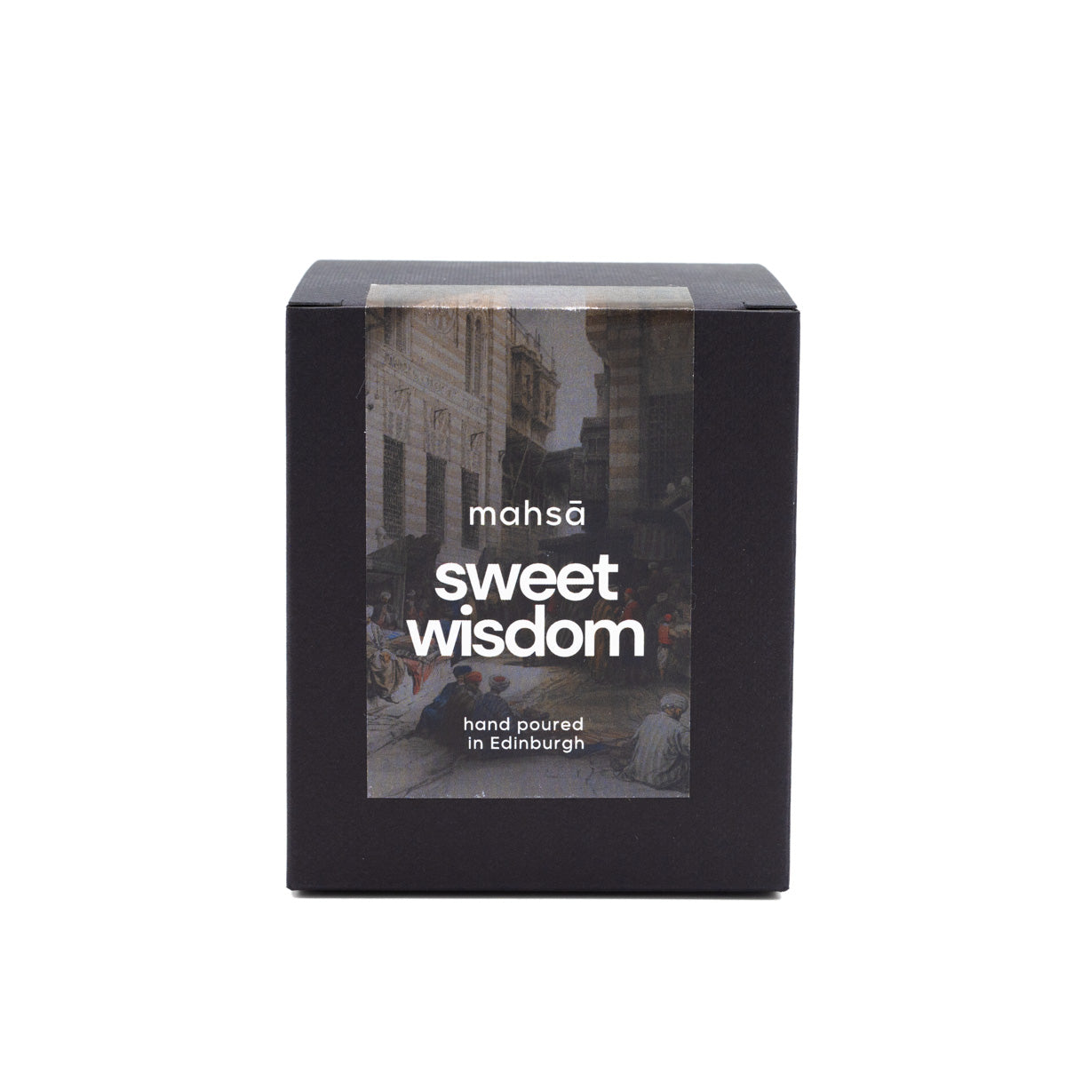 Black box for a candle with a label on it. The label has a photograph of a landscape setting, Mahsa's logo and the words "sweet wisdom".