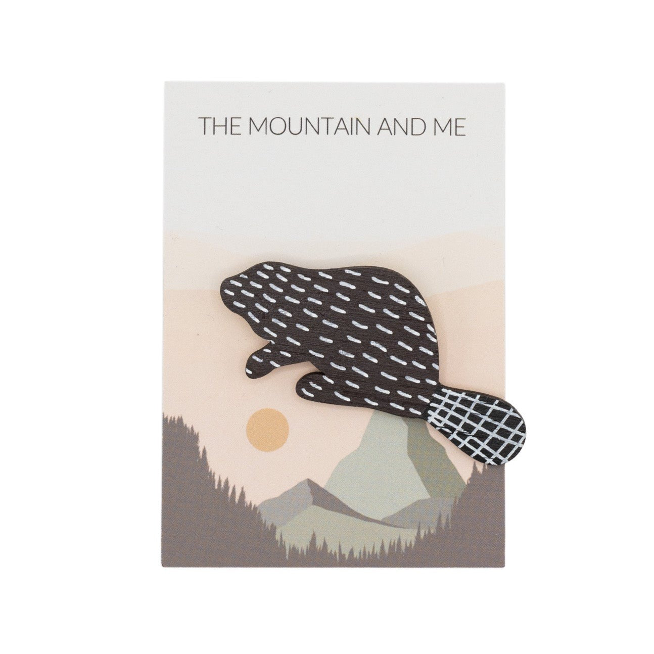 Bamboo broach shaped as a badger against The Mountain and Me Branded Backing Card