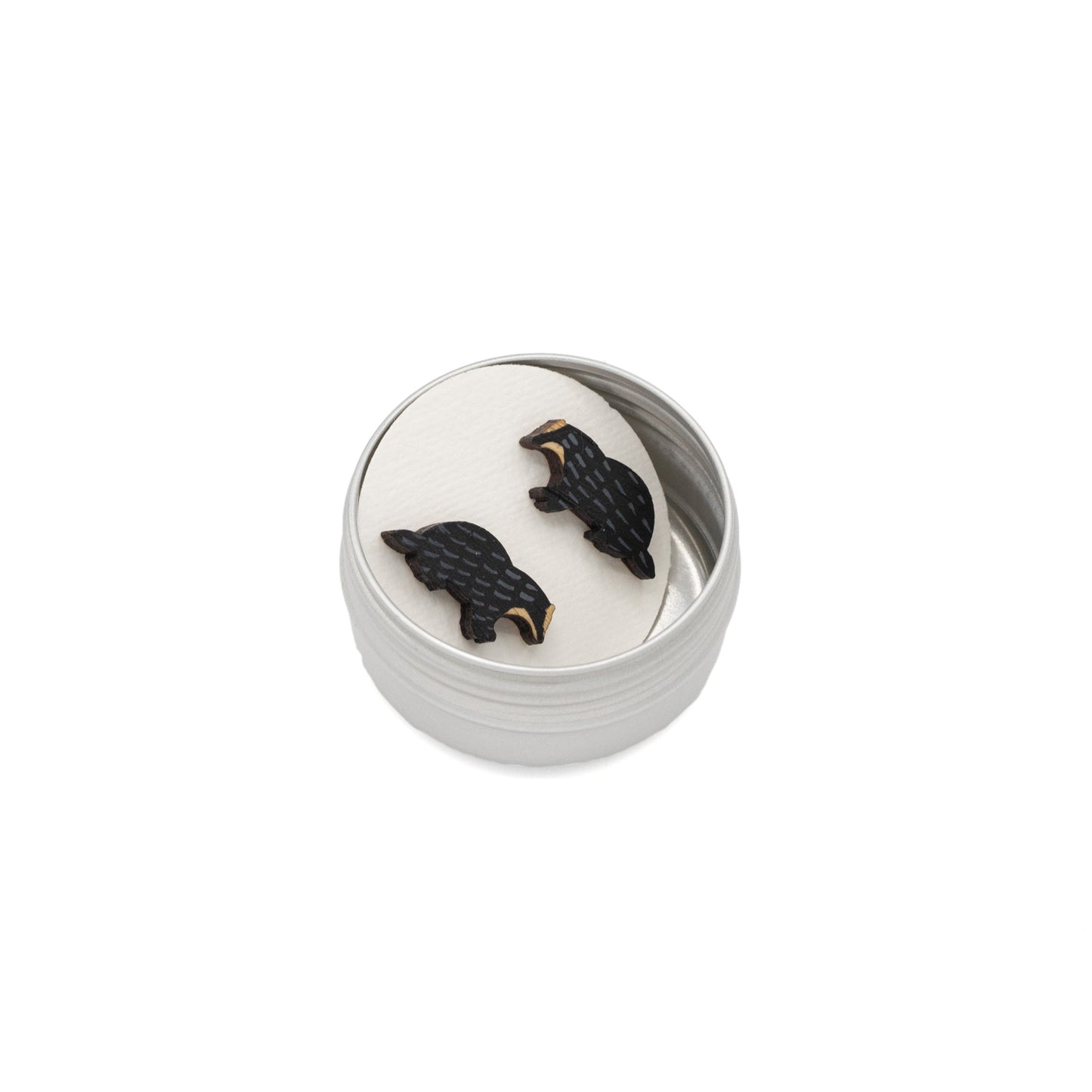 Bamboo stud earrings in the shape of a badger in a metal keepsake tin