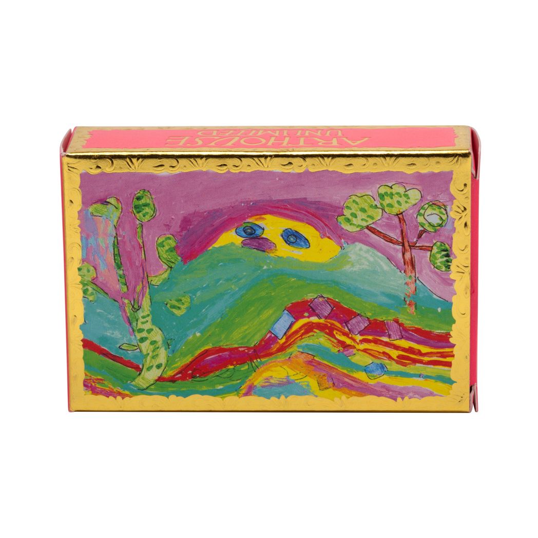 Rectangular soap in the card packaging which has gold embossed decoration around the edge. The Illustration shows an abstract, colourful landscape.