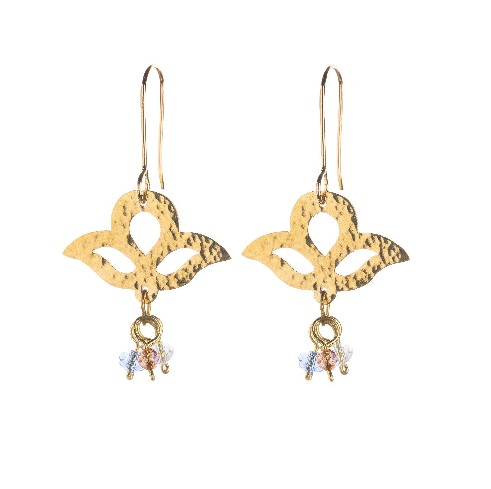 A set of brass hook earrings with three-lobed pendants and three small glass beads dangling from below the pendants.