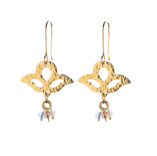 A set of brass hook earrings with three-lobed pendants and three small glass beads dangling from below the pendants.