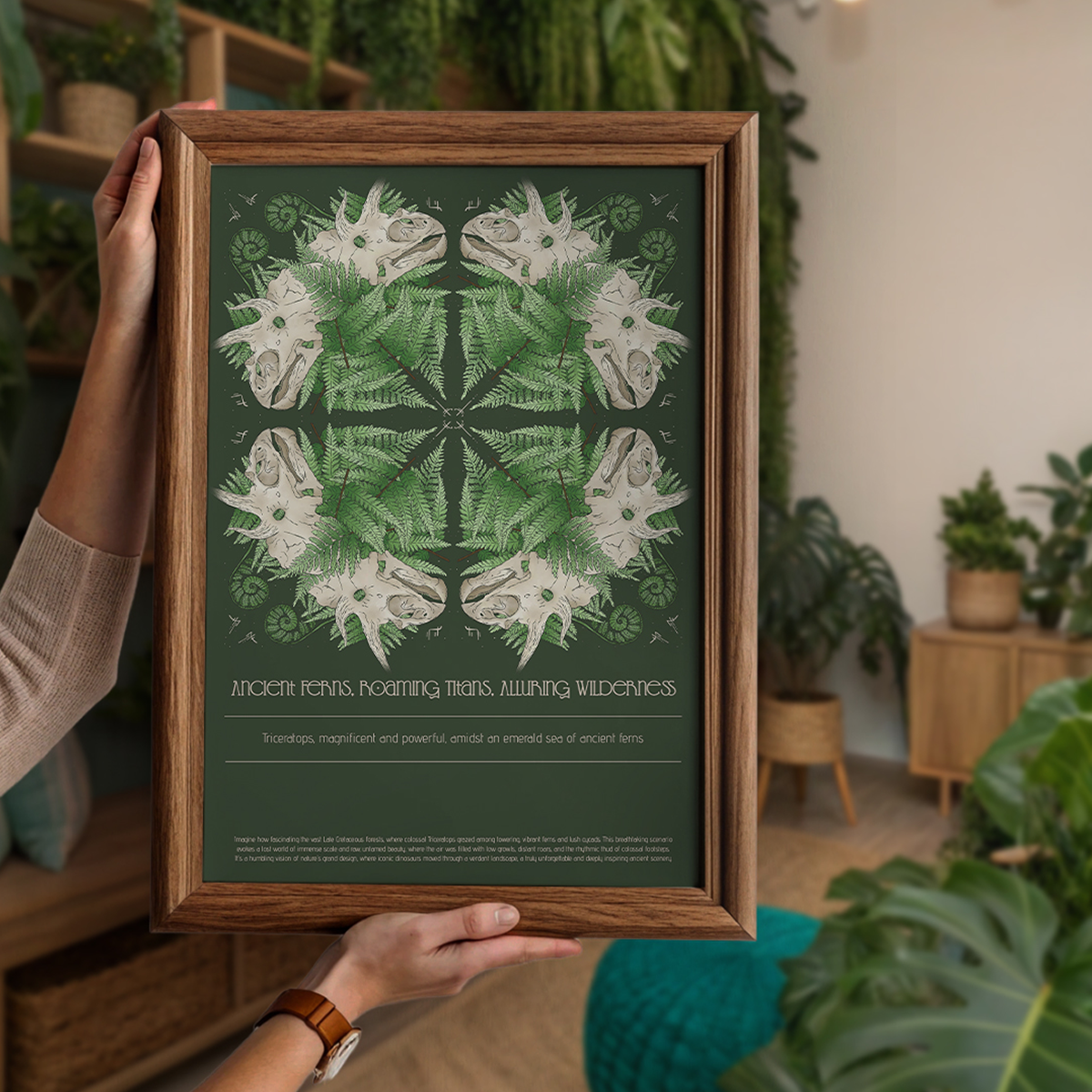 Framed botanical artwork held by a person in a room with plants