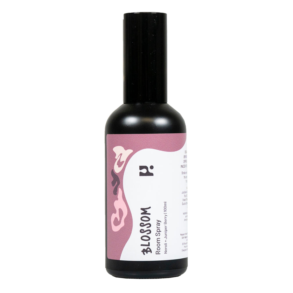 This is a photo of a small, dark-coloured bottle for a Blossom scented soap mist.