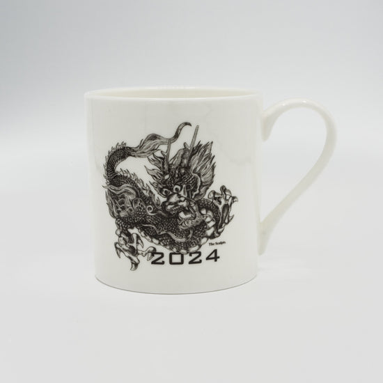 Mug with an illustration of a dragon on it