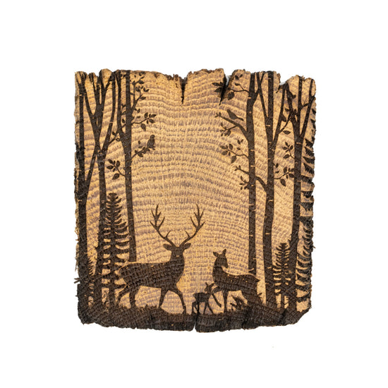 Coaster made out of fence post, with etching of a deer family scene.