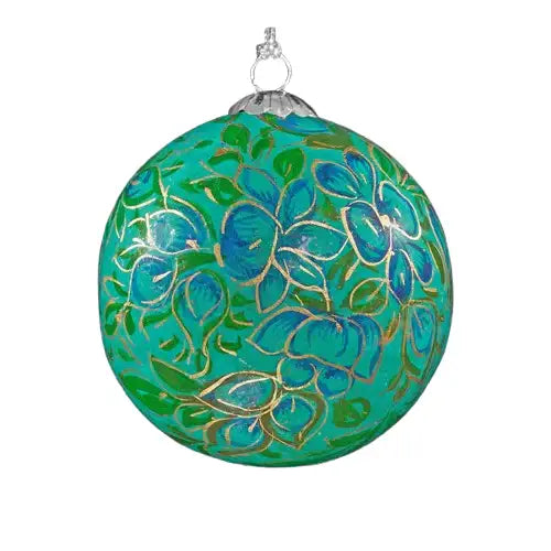 An ornately decorated Christmas ornament with intricate floral patterns in shades of green, blue, and gold.