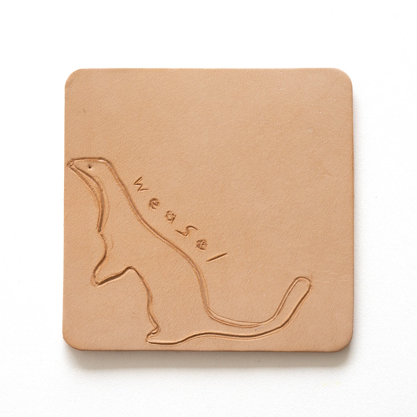 Beige leather coaster with engraving of a weasel