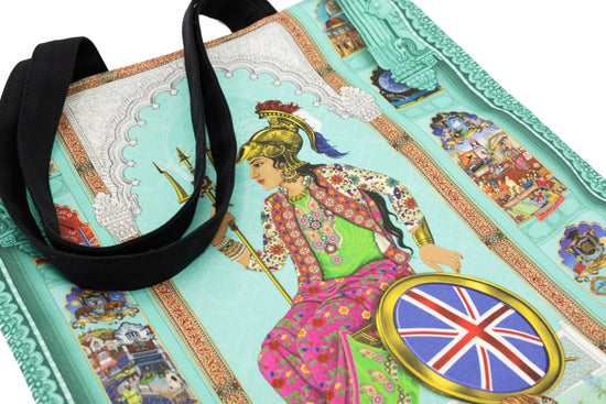 Close up Photograph of Brit-Asia Design Tea Towel by the Singh Twins. Featuring a figure sat in a wheelchair wearing a helmet.