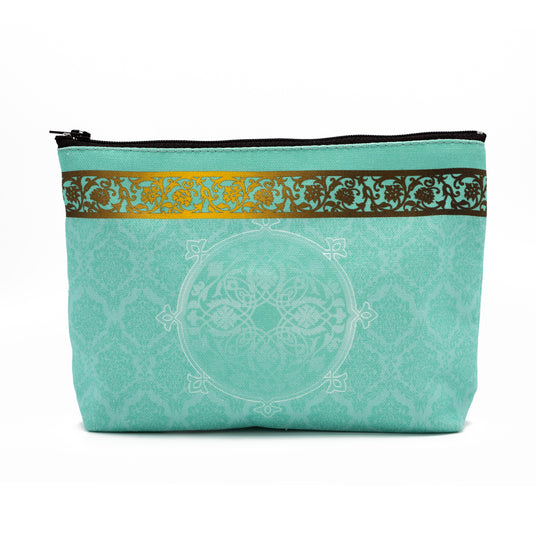 Back of a cosmetics bag featuring The Singh Twins Britt-Asia design. Blue and gold decorative pattern.