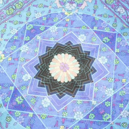 Close up of Singh Twins Knowledge Design. The centre feature.- a star and floral blue pattern.