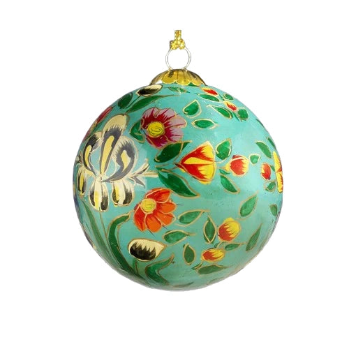 A round, teal-coloured Christmas ornament decorated with colourful flowers, including lilies, tulips, and roses. There are also gold accents and green leaves.