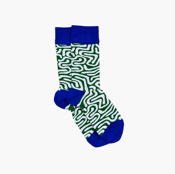 Socks against white background. Pattern is green and white swirls, the toes, heel and top area of the socks are an electric blue.