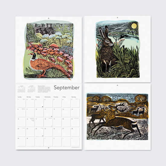 A close-up of the September page from the Angela Harding 2025 Calendar. The page features three linocut prints: a pheasant in a field of flowers, a hare under a full moon, and deer running through a forest. The calendar dates and days of the week are also visible.