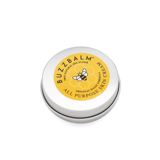 Circular silver tin with yellow label. The label has Buzzbalm's logo, a picture of a bee and information about their All Purpose Skin Cream