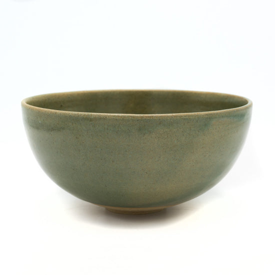Load image into Gallery viewer, Green glazed ceramic plate photographed against white background.

