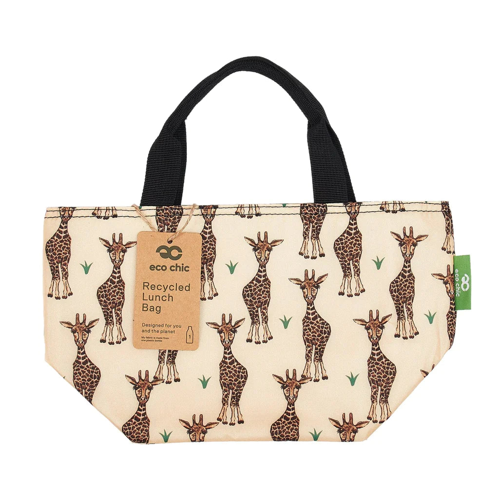 Load image into Gallery viewer, Side view of the girrafe patterned beige lunch bag with a black strap and the brown card tag on the left. 
