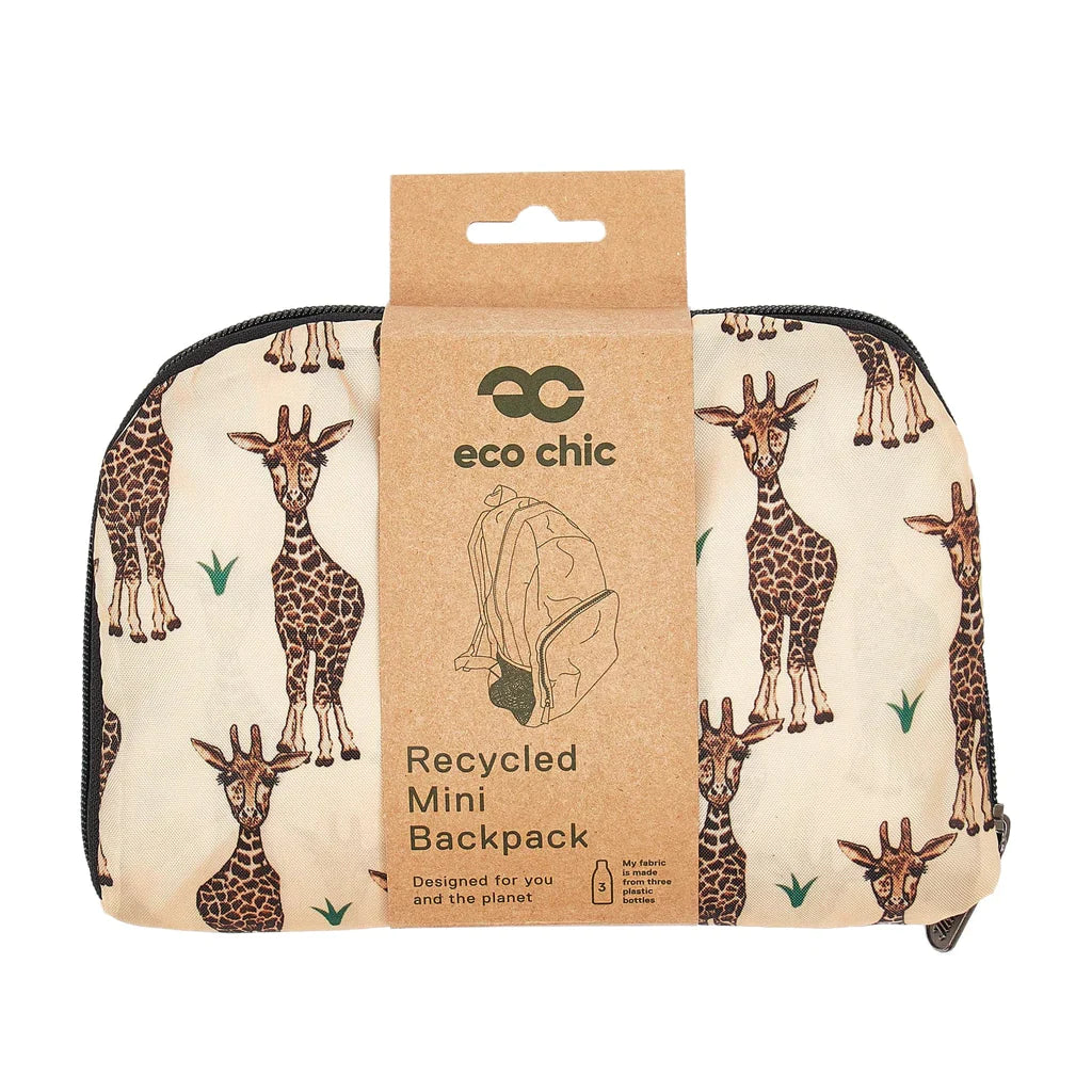 Side view of the beige giraffes backpack folded up and with the brown ard packaging around it.