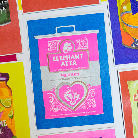 This is a colourful picture of a print showing a bright pink bag of "Elephant Atta", which is a type of flour used for making chapati.