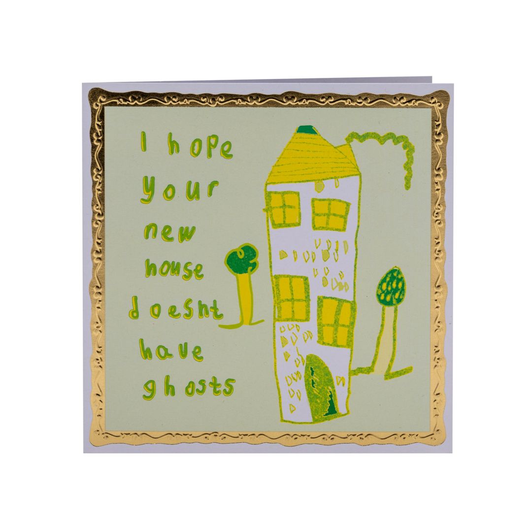 Square card with a pale green background and a tall house illustration on it. Lime green text to the left of the house reads: I hope your new house doesn't have ghosts.