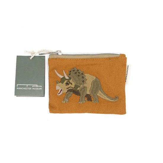 Orange pouch with dinosaur design and Manchester Museum tag on a white background